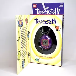 Tamagotchi lila/rosa Bandai 1997 mit offener Box virtuelles Haustier - Bild 1 von 11