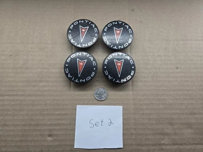 Juego tapacubos central Pontiac OEM 1997-2009 Aztek Bonneville Grand Am Prix 9593169 Foto 1 de 4