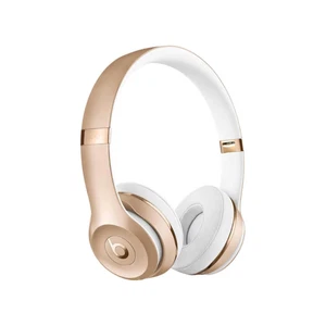 Auriculares inalámbricos Beats by Dr. Dre Solo3 dorados en la oreja - Imagen 1 de 3