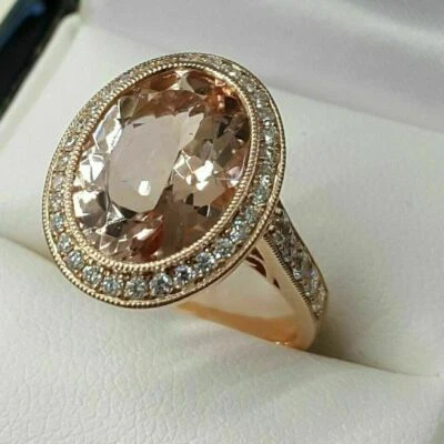 Anillo de compromiso con halo de diamantes creado en laboratorio de morganita acabado oro rosa de 14 k ovalado de 3 quilates Foto 1 de 4