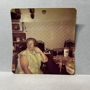 Vintage Found Photo Grandmom In Kitchen Sitting Old Cans Paneling Retro 1970s - Picture 1 of 2