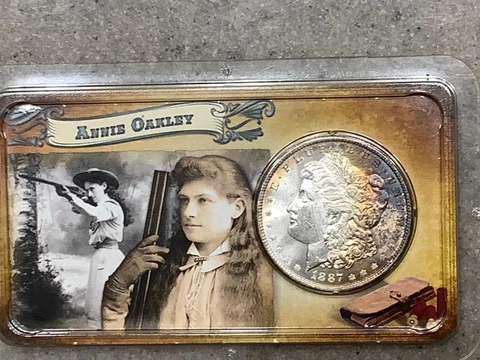 1887 Morgan Silver Dollar "Legends Of The West"Annie Oakley, Nice1 Rainbow Toned Cover