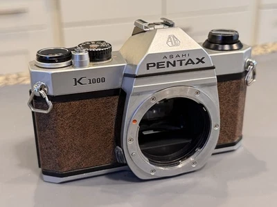 Cámara SLR Pentax K1000 marrón 35 mm - Vientos, incendios - VENDEDOR DE EE. UU. Foto 1 de 4