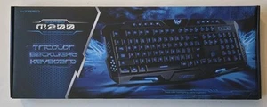 Nuevo teclado retroiluminado para juegos M200 USB con cable diseño de grietas tricolor - Imagen 1 de 6