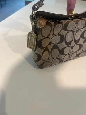 Coach Brown Signature Canvas Wristlet With Gold Accents & Turnlock Closure - Image 1 of 4