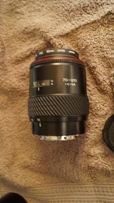Tokina AF 70-210mm f/4.0-5.6 AF Lens with caps front and back and shade - Image 1 of 3