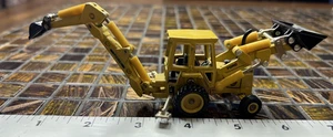 ERTL 1:64 Ford Backhoe Front Loader Yellow Die Cast Toy 2807G Iowa USA 555B E0 - Picture 1 of 7