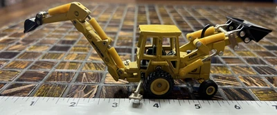 Retroexcavadora Ford ERTL 1:64 cargador frontal amarillo fundido a presión juguete 2807G Iowa EE. UU. 555B  Foto 1 de 4