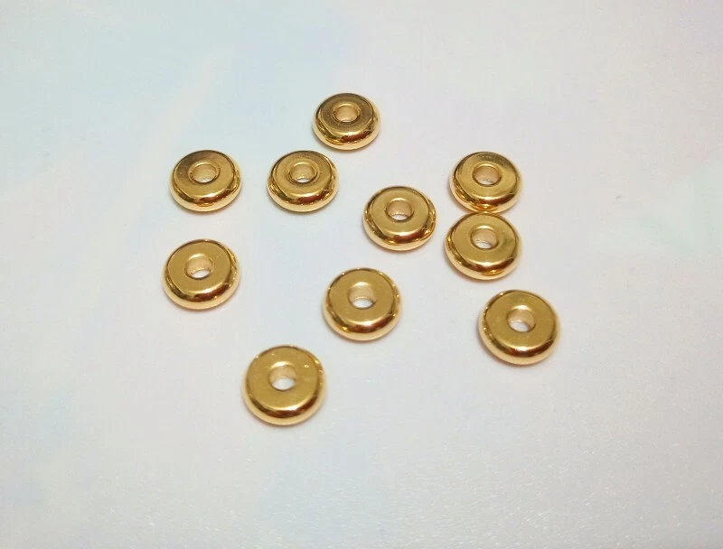 10pz perline distanziali in acciaio inox tondo piatto 6x2mm colore oro bijoux - Immagine 1 di 1