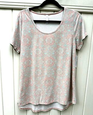 Top para mujer LuLaRoe Classic T talla M FLORAL MELOCOTÓN PÁLIDO COMO NUEVO CON ETIQUETAS NUEVO STOCK ANTIGUO Foto 1 de 4