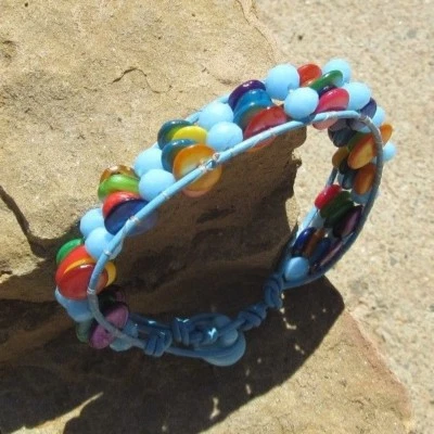 CRYSTAL AND SHELL BRACELET SKY BLUE CRYSTALS AND RAINBOW DYED SHELL VTG BUTTON - Image 1 of 4
