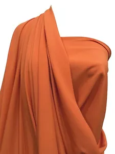 TELA FORRO POLIÉSTER ELÁSTICO NARANJA QUEMADO 49" ANCHO ELÁSTICO MECÁNICO.. - Imagen 1 de 10