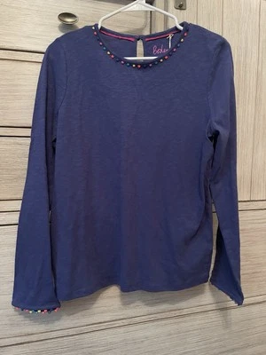 Camisa Boden manga larga nueva con etiquetas para niñas con pompones en cuello y mangas; talla 15-16 años Foto 1 de 4