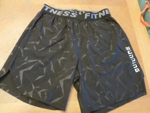 Pantalones cortos de running para hombre, negros con letras reflectantes, cintura elástica M - Imagen 1 de 4
