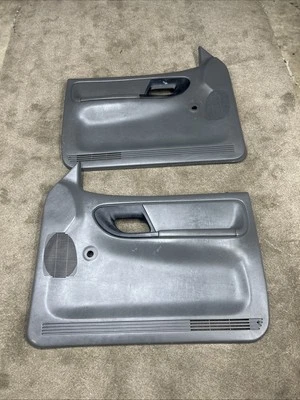 Ford Ranger 1995-2001 par de paneles de puerta manuales gris oscuro OEM envío gratuito Foto 1 de 4