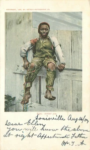 "Sunny Jim". Junger afrikanischer Amarikaner Junge sitzt auf einem Zaun Postkarte verschickt 1904 - Bild 1 von 2