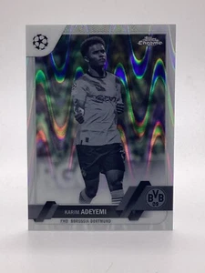 TOPPS UCC CROMO 2022/23 PARALELO KARIM ADEYEMI DORTMUND BLANCO Y NEGRO RAYWAVE - Imagen 1 de 2