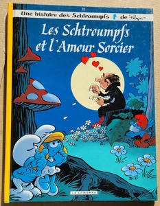 Les Schtroumpfs T 32 Et l'Amour Sorcier PEYO éd Le Lombard Avril 2014 EO - Imagen 1 de 3
