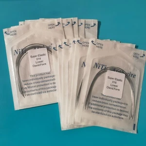 100 paquetes de alambre de arco dental ortodoncia súper elástico Niti redondo forma ovoide diente - Imagen 1 de 5