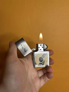 Zippo Feuerzeug Distressed Guitar Company Werbung 2010 - Bild 1 von 5