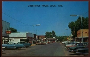 VINTAGE LUCK WI POSTCARD DOWNTOWN SHOWING 1950S AUTOS 080421 Q - Picture 1 of 2