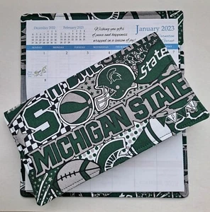 Baumwollstoff Michigan State Spartans 2025-26 Taschenkalender & Terminbuch - Bild 1 von 1