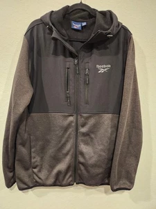 Chaqueta deportiva Reebok para hombre con capucha cremallera completa XL negra gris forrada de lana bolsillos - Imagen 1 de 7