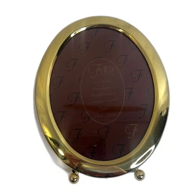 NUEVO Marco de fotos ovalado tono dorado Fetco recubierto de laca de latón macizo 5"x 7" Foto 1 de 4