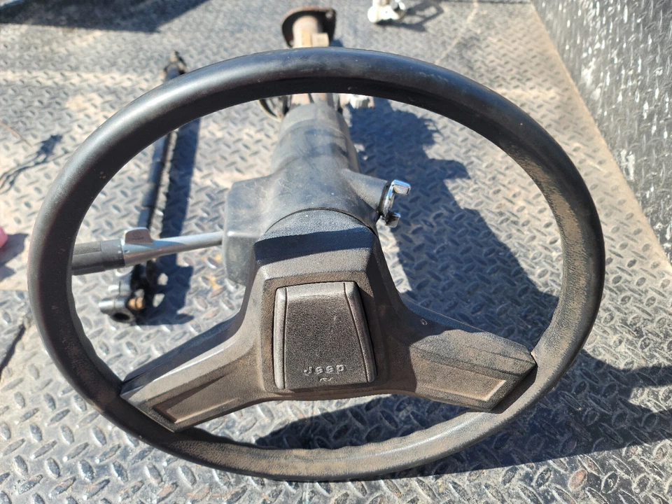 1987 jeep cherokee steering column /shaft /wheel. -NO KEY NON-TILT MANUAL TRANS - Image 1 of 4