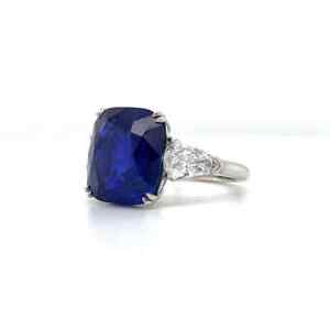 Rich Blue Cushion Shape 9.21CT Sapphire With Pear Shape CZ Three Stone Fine Ring