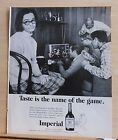 1968 magazine ad for Imperial Whisky - men watch football tiny tv, woman sighs