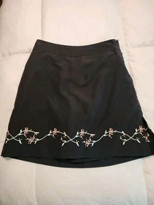 Pantalón corto de golf IZOD X-dry con diseño bordado negro talla 4 - Imagen 1 de 11