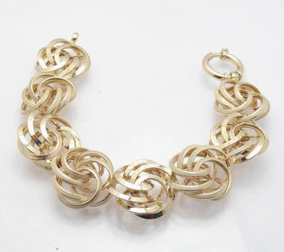 Pulsera Technibond Textura Nudo Amor Roseta 7.5" Chapada en Oro Amarillo 14K Plata Foto 1 de 4