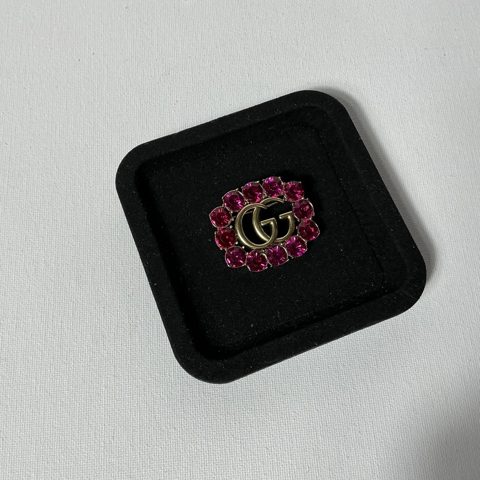 Broche Gucci GG dorado vintage Foto 1 de 4