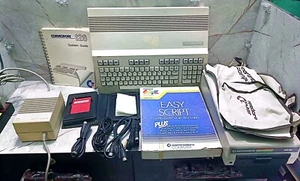 VINTAGE COMMODORE 128 AND FLOPPY DISK AND CATALOG AND ADAPTER - Picture 1 of 10