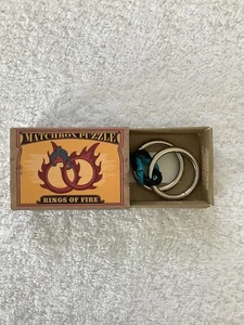 S025 - Matchbox Puzzle - Rings of fire - Geduld-/Geschicklichkeitsspiel - Neu - Bild 1 von 4