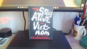 HOW TO STAY ALIVE IN VIETNAM: WHAT IT TAKES TO SURVIVE IN By Robert B. Rigg - Picture 1 of 4