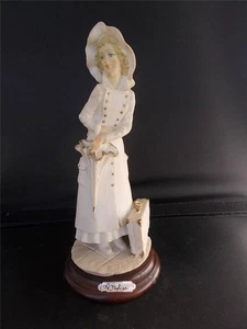 A BELCARI Signed Pucci Figurine Figure of a Lady with Umbrella & Suitcase - Picture 1 of 1