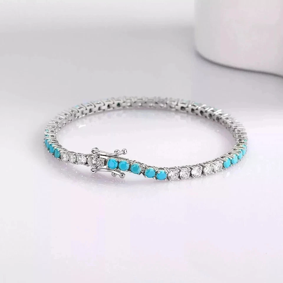Brazalete de tenis turquesa/diamante creado en laboratorio de corte redondo de 4 mm de oro blanco de 14 K Foto 1 de 4