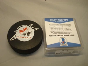Disco de hockey autografiado por el equipo firmado por Ryan Getzlaf de Canadá Beckett certificado de autenticidad BAS 1B - Imagen 1 de 3