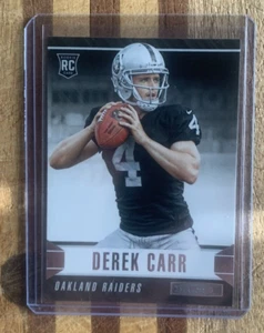 2014 Panini Rookies & Stars Derek Carr tarjeta de novato radiocontrol #131 - Saints - Imagen 1 de 2
