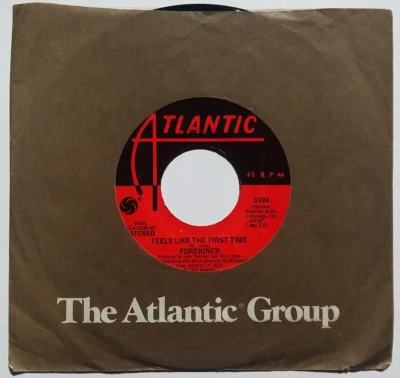 FOREIGNER - Feels Like The First Time / Woman Oh Woman - Vinyl 45rpm 1976 Rock - Image 1 of 4