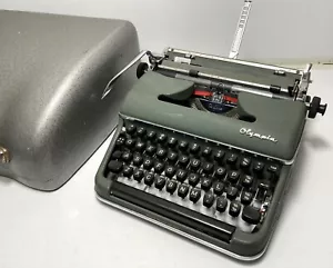 More details for vintage olympia germany de luxe compact typewriter old heavy metal with case