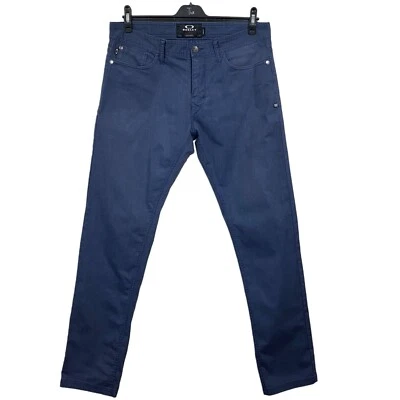 Jeans deportivos de golf azul marino de algodón elástico Oakley. TAMAÑO W34xL32 - Imagen 1 de 4