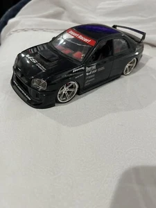 JADA 1/24 scale black IMPORT RACER SUBARU IMPREZA WRX STI, used damaged loose - Picture 1 of 7