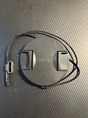 Sony - 55mm Black Plastic Snap-In Front Lens Cap and Strap - Image 1 of 2