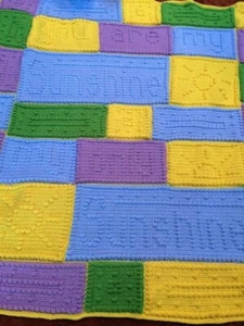 Strickdecke "Du bist mein Sonnenschein mein einziger Sonnenschein" Handarbeit 60" x 60" - Bild 1 von 4