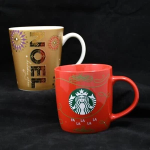 2er Set STARBUCKS Weihnachten Kaffee Tee Becher 2006 Gold Starburst 2020 Rot FaLaLa - Bild 1 von 12