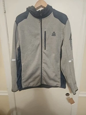 Chaqueta con Capucha Reebok Outerwear Para Hombres XL Cremallera Completa Gris Brezo Azul Marino OMRB585MX NUEVA CON ETIQUETAS Foto 1 de 4