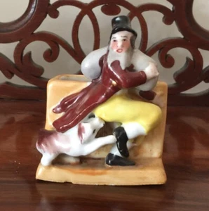 VICTORIAN MATCH STRIKER FAIRING. A DOG BITING A BURGLAR WITH HIS SWAG - Picture 1 of 5